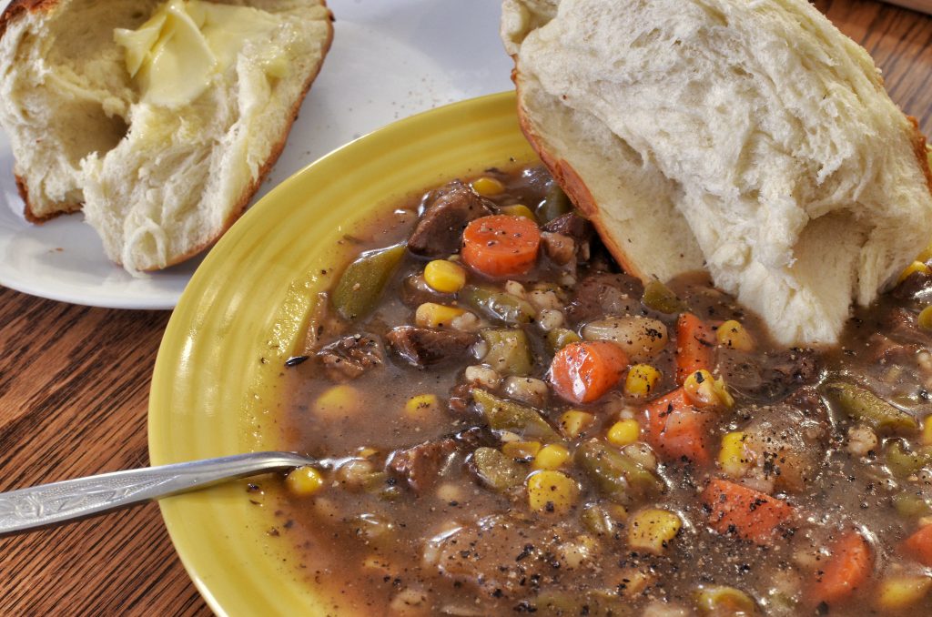 Beef and barley soup with fresh bread,